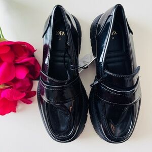 Zara Loafers. Faux patent leather finish. Saddle detail at instep. Rounded toe.